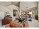 Spacious living room with high ceilings, comfortable seating, and an open floor plan at 27892 N 108Th Way, Scottsdale, AZ 85262