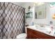 Bathroom with a shower, toilet, and single sink, providing essential amenities at 2944 W Northern Ave, Phoenix, AZ 85051