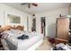 Bright bedroom with a double bed, closet, and dresser, offering ample storage at 2944 W Northern Ave, Phoenix, AZ 85051
