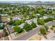 Wide aerial view of neighborhood, complete with lush landscaping and mountain views at 302 E Orange Dr, Phoenix, AZ 85012