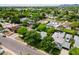 Wide aerial view showcasing the residential neighborhood, greenery, and surrounding area at 302 E Orange Dr, Phoenix, AZ 85012