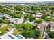 Extensive aerial view displaying the neighborhood with pools, landscaping and architecture at 302 E Orange Dr, Phoenix, AZ 85012