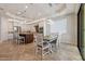 Spacious kitchen and dining area with pendant lighting, island, stainless appliances, and ample cabinetry at 30406 N 54Th St, Cave Creek, AZ 85331