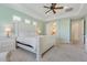 Spacious main bedroom with tray ceiling, ceiling fan, and ensuite bathroom at 30406 N 54Th St, Cave Creek, AZ 85331