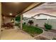 Covered back patio features outdoor seating, manicured lawn, and landscaping for relaxation and entertainment at 321 W Brooks St, Gilbert, AZ 85233
