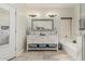 Bathroom with a double vanity, large mirror, tiled floors and a bathtub at 321 W Brooks St, Gilbert, AZ 85233