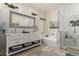 Elegant bathroom with a double vanity, soaking tub, and a separate glass-enclosed shower at 321 W Brooks St, Gilbert, AZ 85233