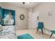 Bright bedroom with daybed, turquoise accents, and neutral walls at 321 W Brooks St, Gilbert, AZ 85233