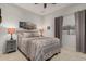 Bright bedroom with unique artwork, grey accents, and carpet flooring at 321 W Brooks St, Gilbert, AZ 85233