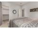 Bedroom with ensuite walk-in closet, neutral walls, and natural light at 321 W Brooks St, Gilbert, AZ 85233