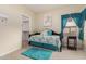 Cozy bedroom with daybed, turquoise accents, and plenty of natural light at 321 W Brooks St, Gilbert, AZ 85233