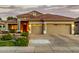 Beautiful single-Gathering home with a three-car garage, tiled roof, and well-maintained landscaping at 321 W Brooks St, Gilbert, AZ 85233