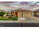 Attractive single-story house with a three-car garage, desert landscaping, and a lovely tiled roof at 321 W Brooks St, Gilbert, AZ 85233
