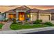 Charming home with attractive desert landscaping, decorative pond, and a three-car garage at 321 W Brooks St, Gilbert, AZ 85233