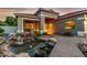 Inviting exterior with a unique pond featuring a charming waterfall feature at 321 W Brooks St, Gilbert, AZ 85233
