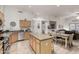 Open-concept kitchen with an island, stainless steel appliances, and easy access to dining and living areas at 321 W Brooks St, Gilbert, AZ 85233