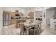 Bright kitchen with stainless steel appliances, a central island, and an adjacent dining area at 321 W Brooks St, Gilbert, AZ 85233