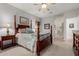 Spacious bedroom with a traditional four-poster bed and access to an ensuite bathroom at 321 W Brooks St, Gilbert, AZ 85233