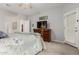 Cozy bedroom with a comfortable bed, dresser, and TV, creating a relaxing and inviting space at 321 W Brooks St, Gilbert, AZ 85233