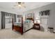 Serene bedroom features a four-poster bed, natural light, and calming decor for a restful retreat at 321 W Brooks St, Gilbert, AZ 85233