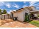 An expansive backyard with a gravel patio and a storage shed at 3514 E Desert Willow Rd, Phoenix, AZ 85044
