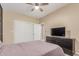 Neutral bedroom with a ceiling fan, carpet, and a dark wood dresser at 3514 E Desert Willow Rd, Phoenix, AZ 85044