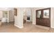 Welcoming entryway with wood flooring, architectural arches, and a view to the living room at 3514 E Desert Willow Rd, Phoenix, AZ 85044