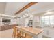 Modern kitchen with stainless steel appliances, a butcher block island, and white cabinets at 3514 E Desert Willow Rd, Phoenix, AZ 85044
