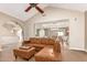 Open-concept living room flowing into the dining area, featuring wood floors and neutral tones at 3514 E Desert Willow Rd, Phoenix, AZ 85044