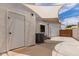 Side yard patio with a sun shade, AC unit and a white exterior door at 3514 E Desert Willow Rd, Phoenix, AZ 85044