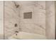 Bright bathroom featuring white marble tile in the tub and shower at 3619 E Marmora St, Phoenix, AZ 85032