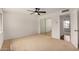 Bright bedroom with carpet, ceiling fan and large mirrored closet at 3619 E Marmora St, Phoenix, AZ 85032