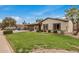 Attractive single-story home with a neatly manicured lawn, desert landscaping, and an attached two-car garage at 3619 E Marmora St, Phoenix, AZ 85032