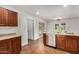 Kitchen with stainless steel dishwasher, wooden cabinets and eat in bar at 3619 E Marmora St, Phoenix, AZ 85032