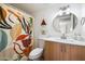 Stylish bathroom featuring updated vanity and colorful shower curtain at 3737 E Turney Ave # 206, Phoenix, AZ 85018