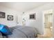 Cozy bedroom showcasing the ensuite bathroom and kitchen entrance at 3737 E Turney Ave # 206, Phoenix, AZ 85018