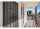 Condo entrance featuring a security door and a view of the community pool at 3737 E Turney Ave # 206, Phoenix, AZ 85018