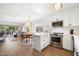 Bright kitchen with island, stainless steel appliances and white cabinets and dining area at 3737 E Turney Ave # 206, Phoenix, AZ 85018
