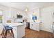 Kitchen with white cabinets and an island, stainless steel appliances and bright lighting at 3737 E Turney Ave # 206, Phoenix, AZ 85018