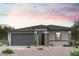 Charming single-story home with a two-car garage and a beautifully xeriscaped front yard, perfect for low-maintenance living at 39965 W Sparks Ln, Maricopa, AZ 85138