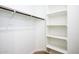 Walk-in closet with custom shelves and a hanging rack to maximize storage at 4063 E Amoroso Dr, Gilbert, AZ 85296