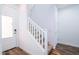 Entryway featuring white door, staircase and wood floors at 4063 E Amoroso Dr, Gilbert, AZ 85296