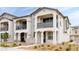 Charming two-story townhome featuring a private balcony, neutral stucco, and well-maintained landscaping at 4063 E Amoroso Dr, Gilbert, AZ 85296