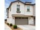 A modern two-car garage with grey doors and tasteful stone accents, complementing the home's exterior at 4063 E Amoroso Dr, Gilbert, AZ 85296