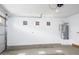 Spacious two-car garage with bright lighting, an insulated door, and a water heater at 4063 E Amoroso Dr, Gilbert, AZ 85296