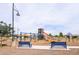 Community playground with a variety of play structures for children of all ages to enjoy at 4063 E Amoroso Dr, Gilbert, AZ 85296
