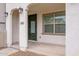 Welcoming front porch with arched columns and a green door at 4063 E Amoroso Dr, Gilbert, AZ 85296