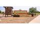 The Warner Meadow community brick signage is surrounded by desert landscaping and low-water plants at 4063 E Amoroso Dr, Gilbert, AZ 85296