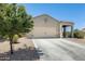 Charming single-story home featuring a well-maintained front yard and neutral-colored exterior at 4080 N 309Th Cir, Buckeye, AZ 85396