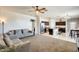 Bright and airy living room featuring a large open space connected to the kitchen and dining area at 4080 N 309Th Cir, Buckeye, AZ 85396